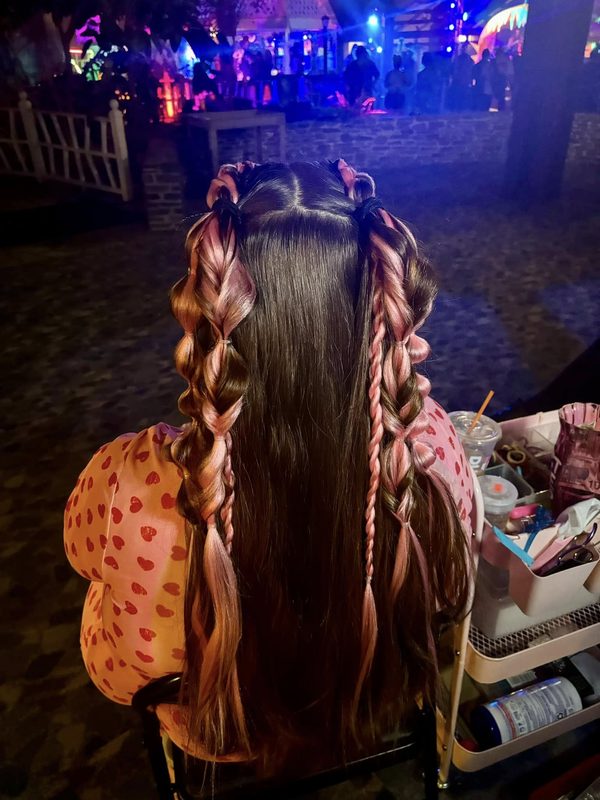 Colorful festival braids under evening lights
