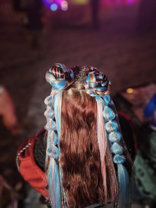 Colorful embroidery floss hair wraps woven through hair