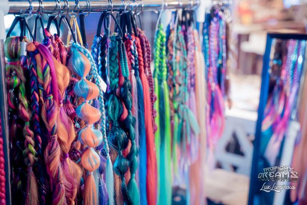 A rack of colorful braided ponytails